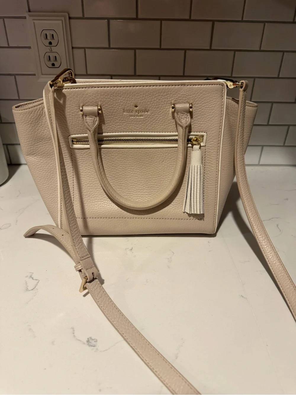kate spade pebble leather satchel in light cream with tassel